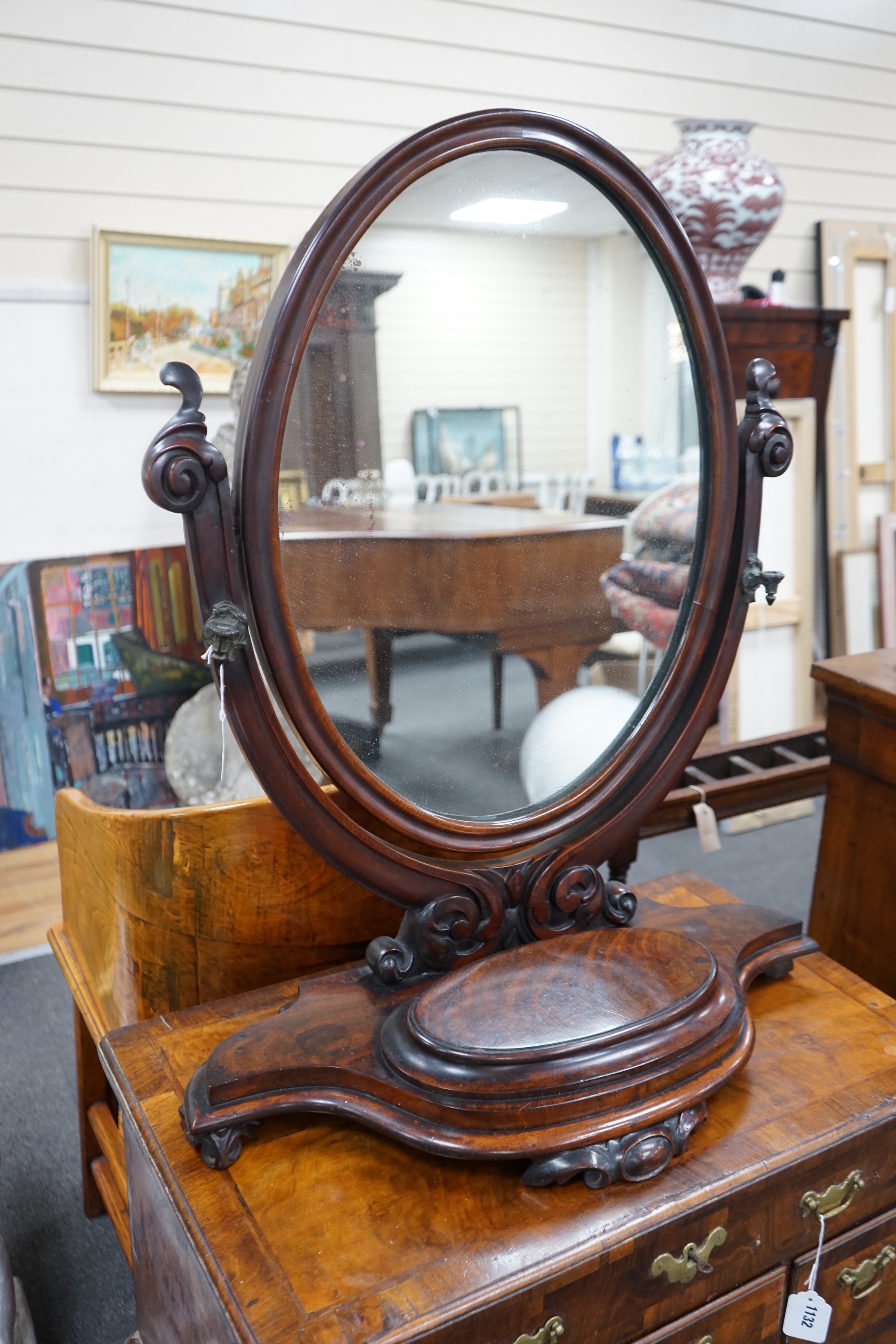 A Victorian mahogany toilet mirror with compartment base, width 66cm, height 82cm